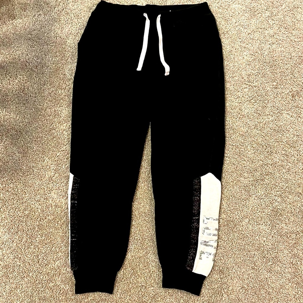 Black (LOVE) joggers from Fashion Nova but tag says reflex